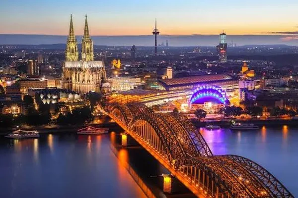 Cologne Cathedral and the Hohenzollern Bridge at dusk, Germany