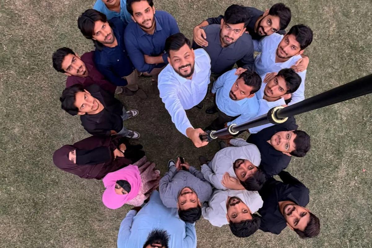 The Digital Vikingz team in a circle on the lawn, photographed from above with a selfie stick